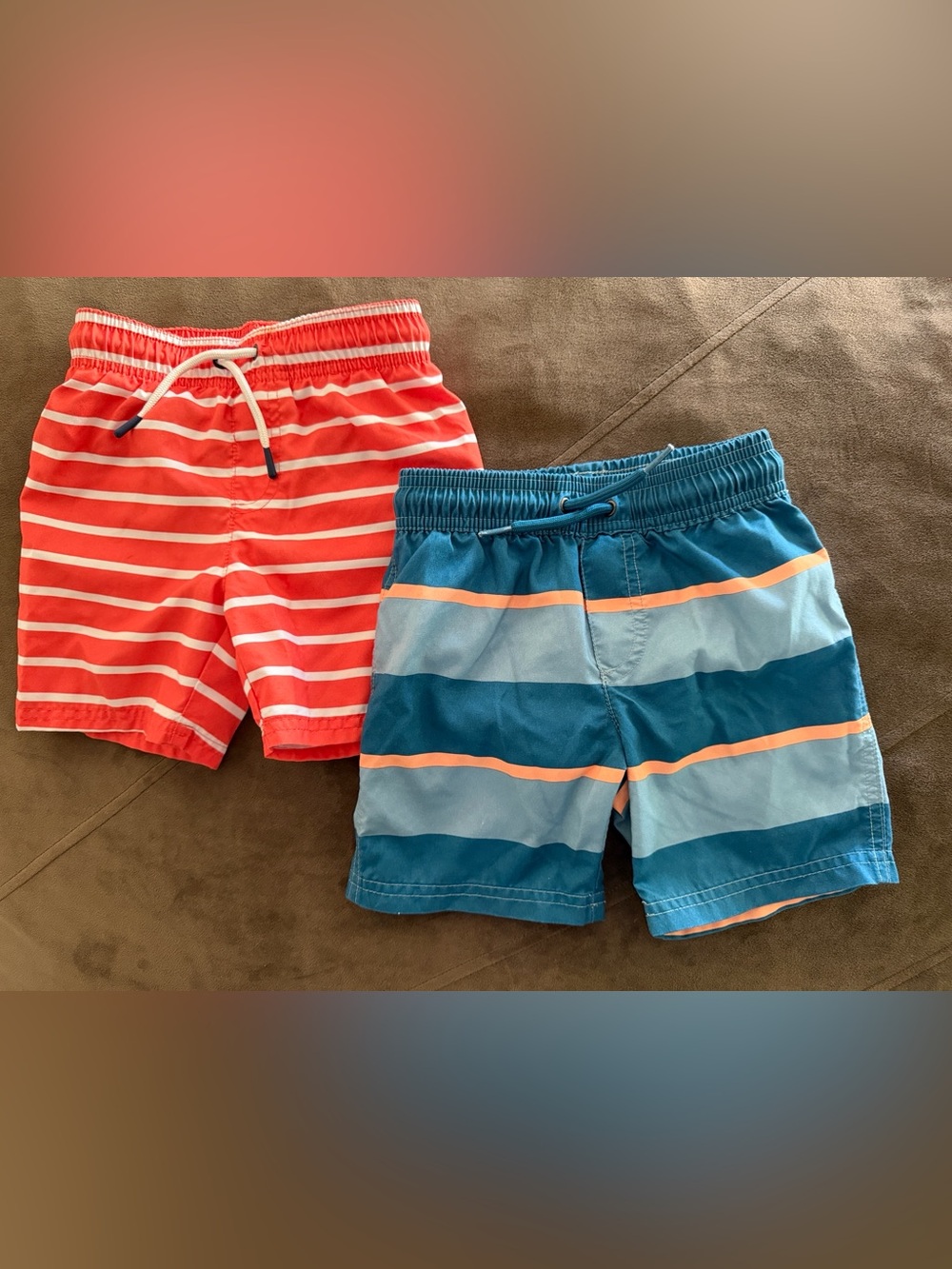 Boys Two-Pack Swim Trunks in orange and white striped &  blue multi color stripe